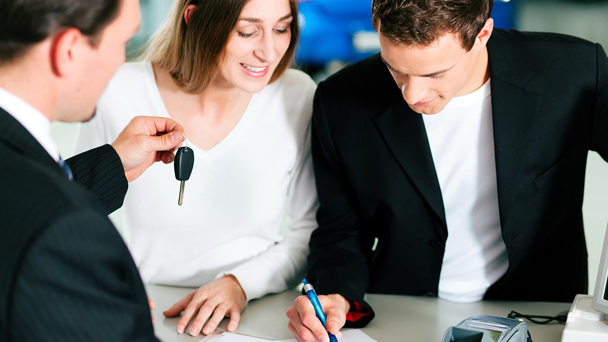 Finance Image of a Couple Signing Documents